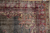 Textured distressed Turkish Sparta rug, showing cherry red, ivory, and exposed foundation.