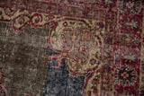 Distressed vintage Sparta rug detail: visible foundation, worn pile in cherry, ivory, cobalt blue.