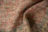 Distressed pile texture of vintage Oushak rug in faded cherry red, ivory, and seafoam green.