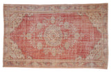 Distressed Oushak carpet with cherry red field, ivory floral medallion, 7' x 11'3