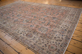 Distressed vintage Sparta carpet's field, with Herati leaves, blossoms, dark pink and navy.