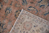 Distressed vintage Sparta rug pile with navy Herati motifs and light beige knotted reverse.