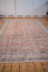 Distressed Sparta Carpet pile showing terracotta, ivory, and slate blue wear.