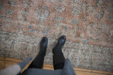 Distressed Turkish Sparta carpet close-up, apricot palmettes, blue blossoms, worn pile.