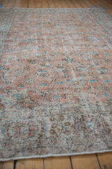Distressed vintage Turkish Sparta rug, apricot, ivory, sky blue floral pattern.