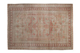 Distressed vintage Oushak carpet with pale raspberry red floral medallion and oxidized silver field, 6'10