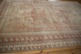 Distressed vintage Oushak rug border with oxidized silver and pale raspberry geometric motifs.