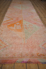 Distressed hand-knotted Kurd runner showcasing tangerine, pink, and silver diamond motifs and abrashes.