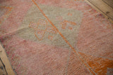 Distressed hand-knotted pile of a Kurd runner with pink, beige, and tangerine abrash.