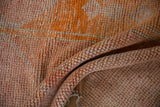 Distressed hand-knotted Kurd rug pile featuring tangerine, pink, and silver abrashes.