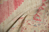 Distressed Oushak rug pile with dusty red, aqua geometric hook and latch border.