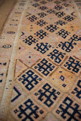 Navy geometric motifs with nuanced details and varied pile texture on vintage Kurd runner.