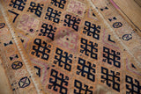 Distressed Kurd runner close-up, showcasing geometric lattice and high-low pile.