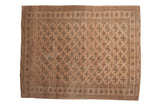 Hand-knotted vintage distressed Turkmen carpet with geometric elephant footprint gul motifs.
