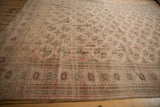 Distressed vintage Turkmen border with geometric checkered patterns and elephant footprint guls.