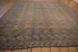 Distressed vintage Ersari rug border and field, with geometric gul patterns and abrashed dusty teal.