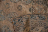 Distressed Ersari design carpet pile with a clear geometric pattern on its hand-knotted foundation and selvage.
