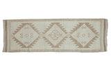 Vintage distressed Kurd runner, hand knotted, triple serrated medallions, cream and coffee tones.