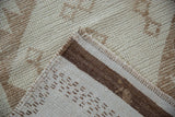 Distressed Kurd runner reverse showing hand-knotted structure, original braided selvages and cream brown pile.