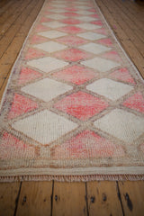 Distressed textured pile of Kurd runner with fuchsia and ivory diamond lattice.