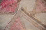 Hand-knotted back and secured side selvage of a distressed Kurd rug runner.