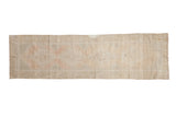 Vintage Distressed Oushak runner with faded central medallions in ivory, blush, and seafoam green.