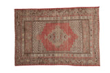 Distressed vintage Kula rug with dusty cherry red medallion, beige and brown patterns, 3'3