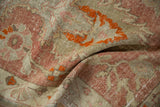 Distressed Oushak runner pile, mostly even wear, in raspberry, tangerine, and ivory.