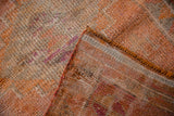 Distressed Kurd runner pile texture, with woven reverse in orange, beige, purple shades.
