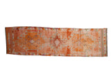 Distressed vintage Kurd runner, abrashed orange field, geometric medallions, playful border, 3x10'7
