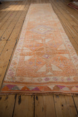 Distressed Kurd runner with even wear, geometric pattern, and tightly woven end.