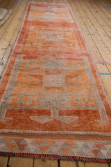 Distressed Kurd runner, detailed end border with tangerine, silver triangles, madder red fringe.