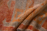 Distressed vintage Kurd rug pile shows primitive madder red and tangerine pattern.