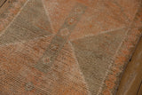 Distressed vintage Kurdish rug runner pile with pale saffron and oxidized silver geometric patterns.