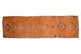 Vintage distressed Kurd rug runner in saffron orange with single column navy blue center medallions.