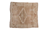 Decorative distressed Oushak square rug, abrashed beige field with a pale pink medallion, 5'2