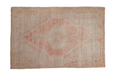 Distressed Oushak rug with pink center medallion and soft multi-tone abrash, 4'10