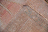 Intact original side cord and hand-knotted foundation of a distressed vintage Oushak rug.