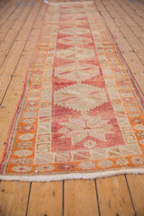 Distressed vintage Kurd runner pile, highlighting serrated geometric motifs and intact side selvages.