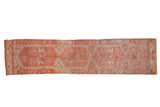 Distressed Kurd runner with tangerine orange, silver, ivory geometric stepped medallions and starbursts.