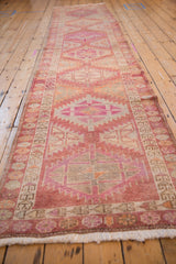 Original side cord selvage and ivory fringe of a distressed Kurd rug runner.