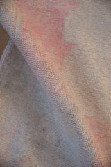 Close view of even wear across the knot heads on a distressed vintage Oushak rug.