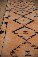 Close-up of vintage distressed Kurd runner pile showing tangerine orange and navy diamond motif.