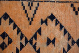 Textured distressed Kurd runner pile, navy serrated gul motifs on tangerine orange.