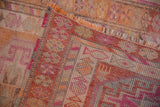 Distressed Kurd runner's texture with fuchsia, tangerine geometric patterns and original selvage.