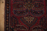 Vintage Sarouk rug's border with slight dog-ear, minor selvage loss, and floral pattern.