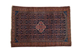 Vintage Hamadan rug, quatrefoil medallion, Herati field in navy, blush, and saffron.
