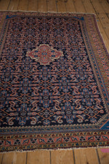 Vintage Hamadan rug showing navy, blush Herati pattern and cobalt floral border.