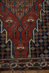 Detail of floral cross-sections and geometric outlines on a vintage Persian Hamadan rug.