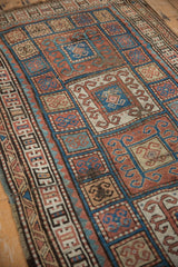 Antique Kurdish runner's inverted rust, blue, ivory rams horn patterns.